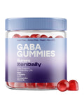 Jar of Sumera ZenDaily GABA Gummies with a light blue lid and a blue-to-purple gradient label, with two red gummies resting beside it. The label reads calm support for everyday life and lists GABA, L-Theanine, 5-HTP, Ashwagandha and Vitamin B6.